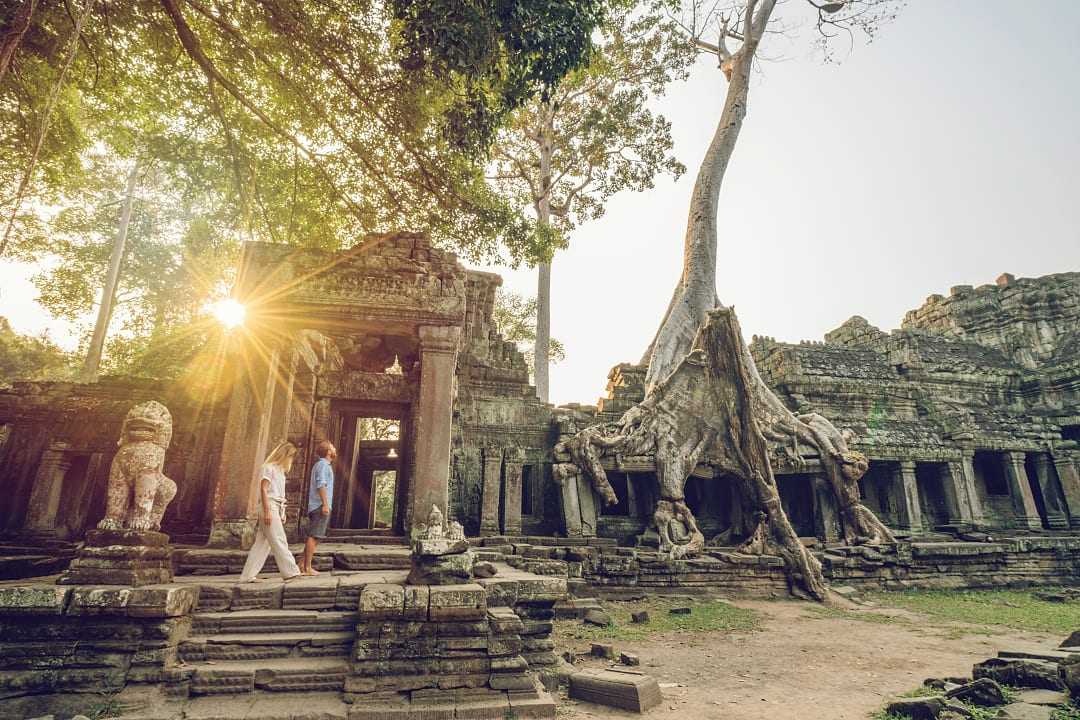 Couple exploring Angkor Wat in Siem Reap, Cambodia