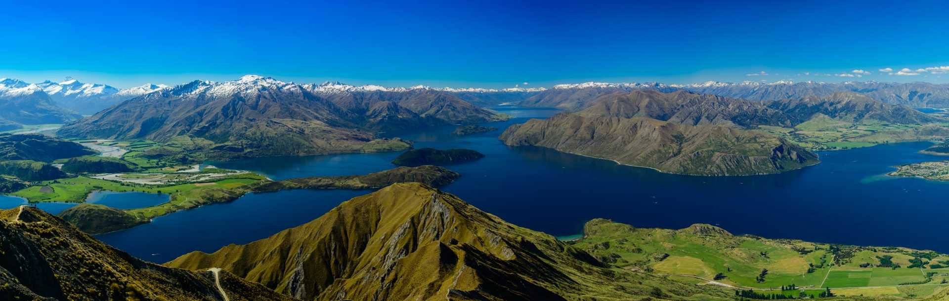 View of New Zealand's Roy's Peak between Wanaka and Glendhu Bay with Mount Aspiring/Tititea in the background.