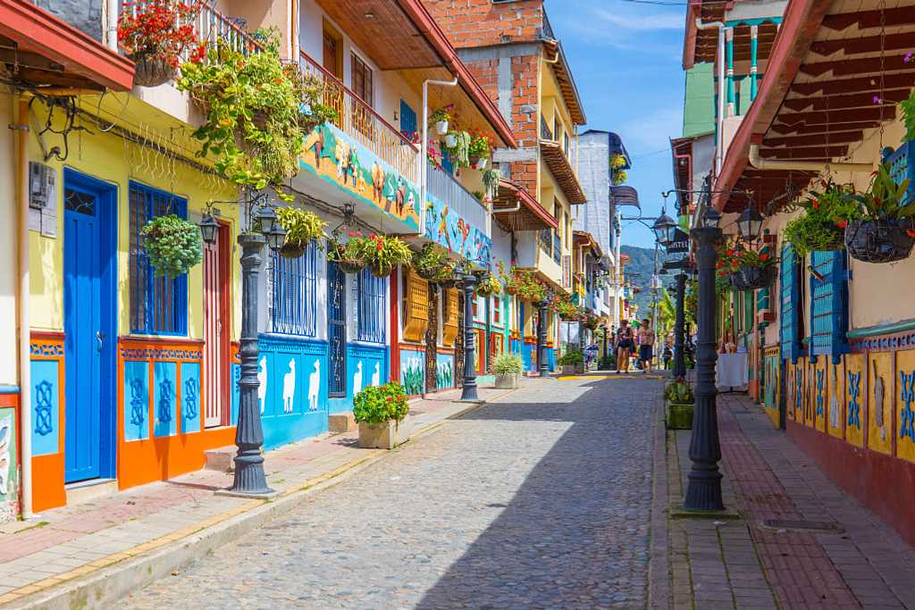 Cobblestone street with colorful buildings in Guatape, Colombia