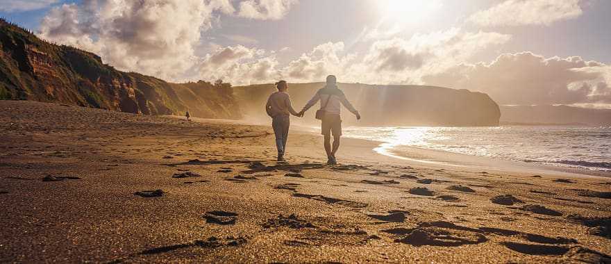 Couple walking on the beach in Sao Miguel, Azores, Portgal