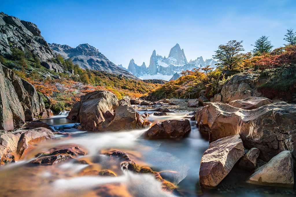 Stream and autumn colors in El Chalten with Fitz Roy mountain in Argentina