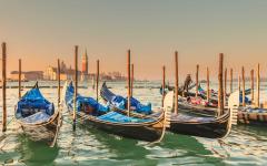 A row of gondolas in Venice, Italy. 