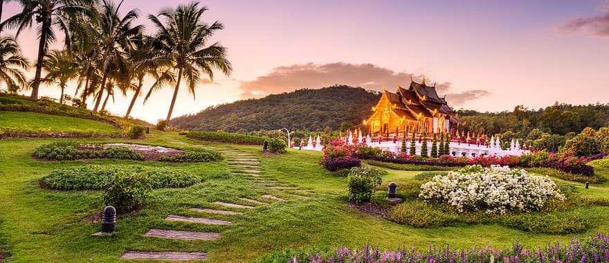 Pathway through gardens leading to Kor Khum Luang Temple at Royal Park Rajapruek in Chiang Mai, Thailand