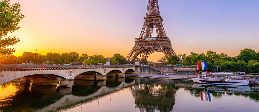 A river cruise on the Seine passing by the Eiffel Tower. A river cruise on the Seine passing by the Eiffel Tower.