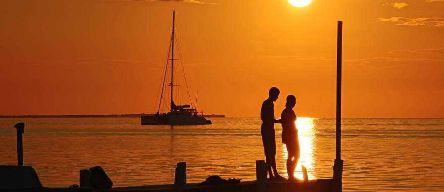 Couple enjoying a romantic sunset in Belize