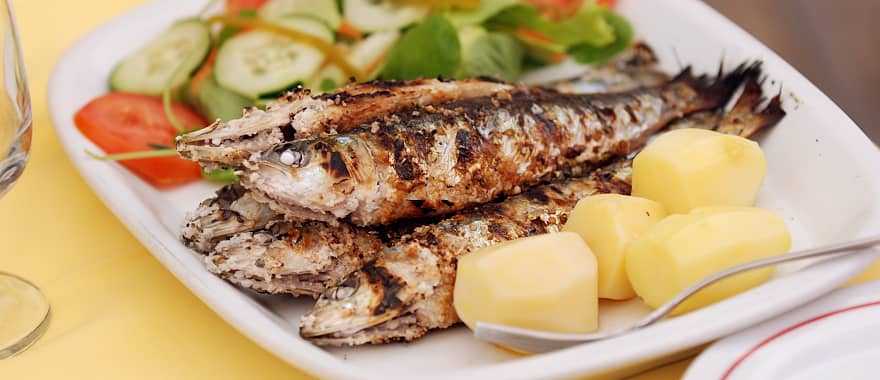 Grilled sardine served at a restaurant in Lisbon, Portugal