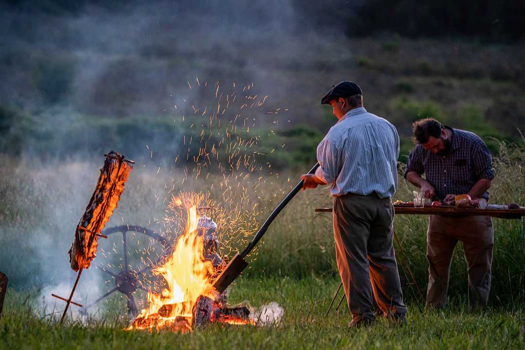 Gauchos preparing asado in Argentina