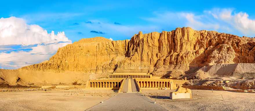 Famous History of Egypt Tour Temple of Queen Hatshepsut beneath the cliffs at Deir el-Bahari in Egypt.