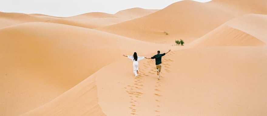 Couple at the Sahara desert in Morocco Couple at the Sahara desert in Morocco