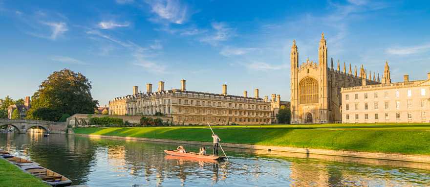 Cam River in Cambridge, England Couple punting on Cam River in Cambridge, England