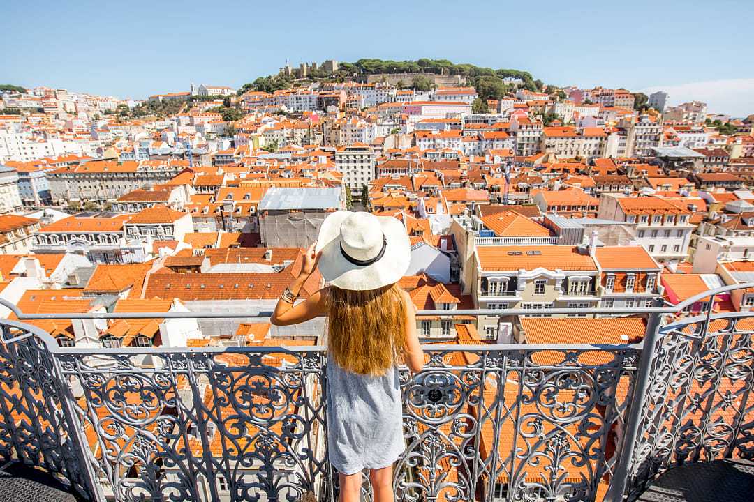Female traveler at overlook in Lisbon, Portugal