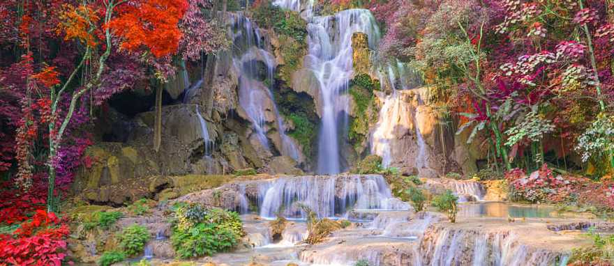 Beautiful autumn colors surround Kuang Si Waterfall in Luang Prabang, Laos. Beautiful autumn colors surround Kuang Si Waterfall in Luang Prabang, Laos.