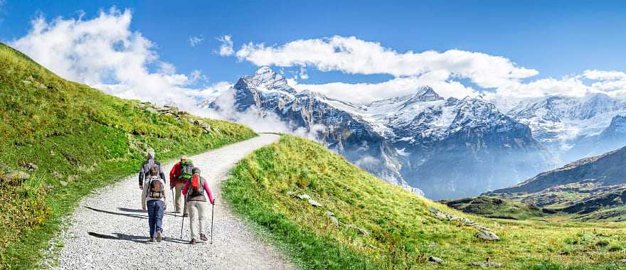 Family hiking in the Swiss Alps