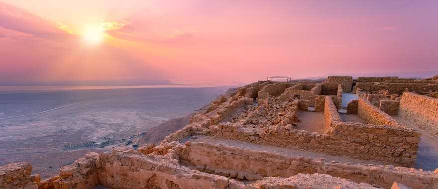 Sunset over Masada fortress in Judaea desert, Israel