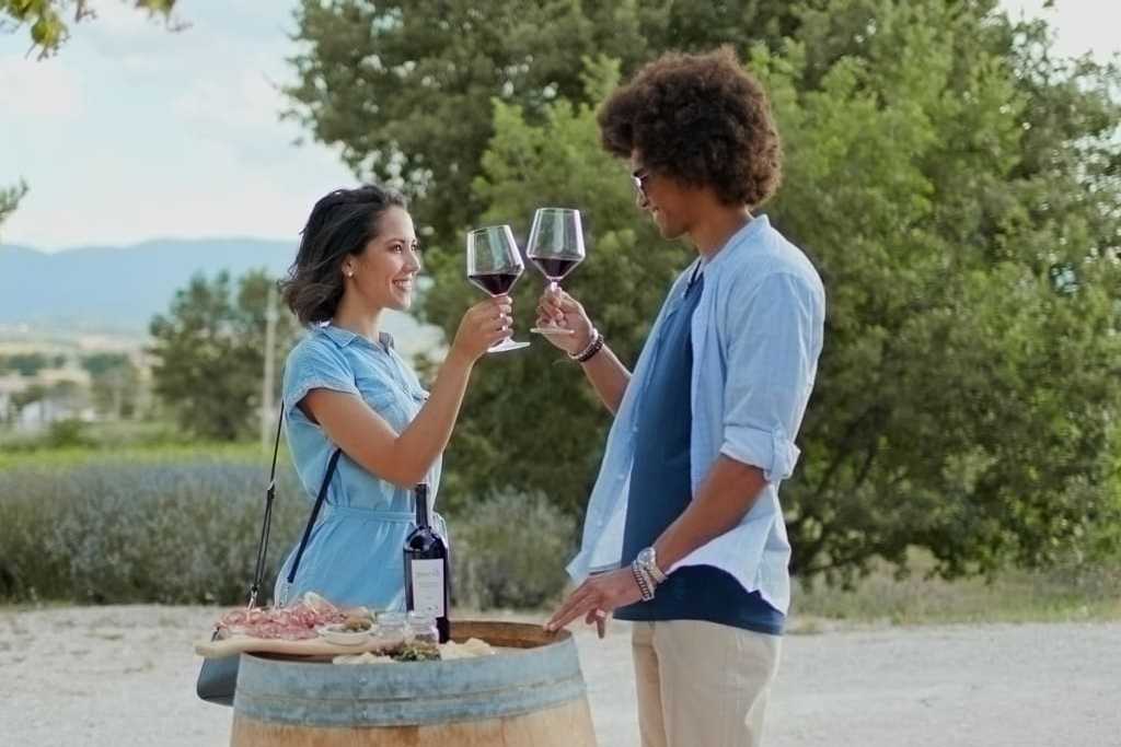 A couple is tasting young wine at one of the wineries in Italy, Umbria region