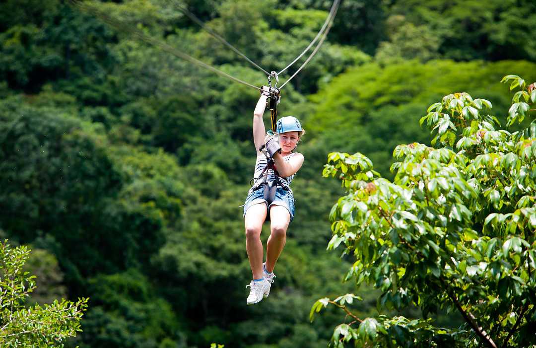 Ziplining in Costa Rica Young girl ziplining in Costa Rica