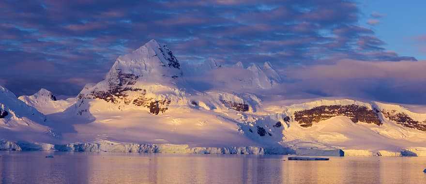 Mountain illuminated by sunset in Antarctica
