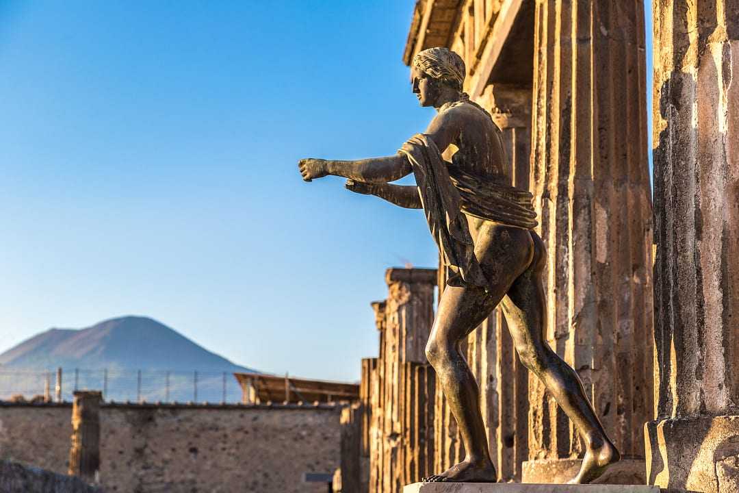 Bronze Apollo statue of the Temple of Apollo ruins at Pompeii in Naples, Italy