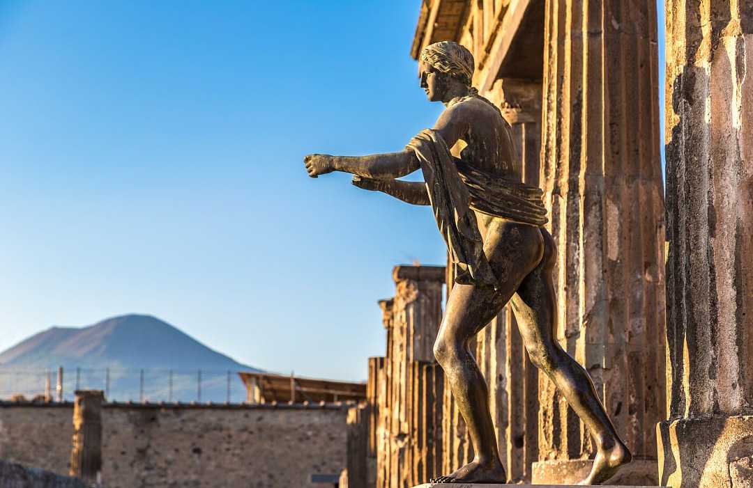 Temple of Apollo at Pompeii in the Campania region, Italy Bronze Apollo statue of the Temple of Apollo ruins at Pompeii in Naples, Italy