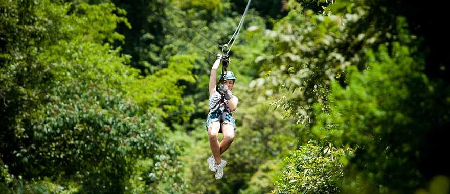 Teenage girls zip lining in Costa Rica