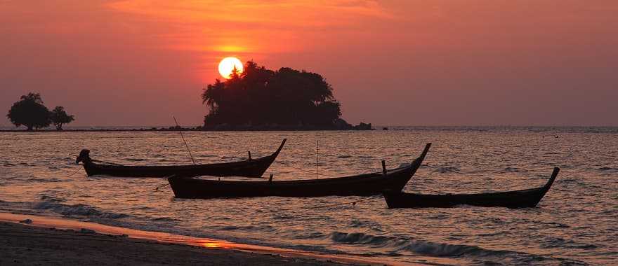 Sunset at Nai Yang beach in Phuket, Thailand.