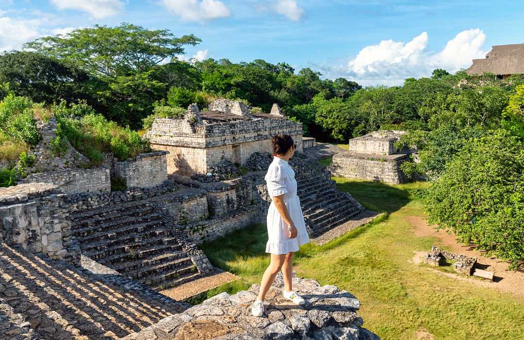 Yucatan, Mexico Woman looking out at Mayan ruins in Yucatan, Mexico