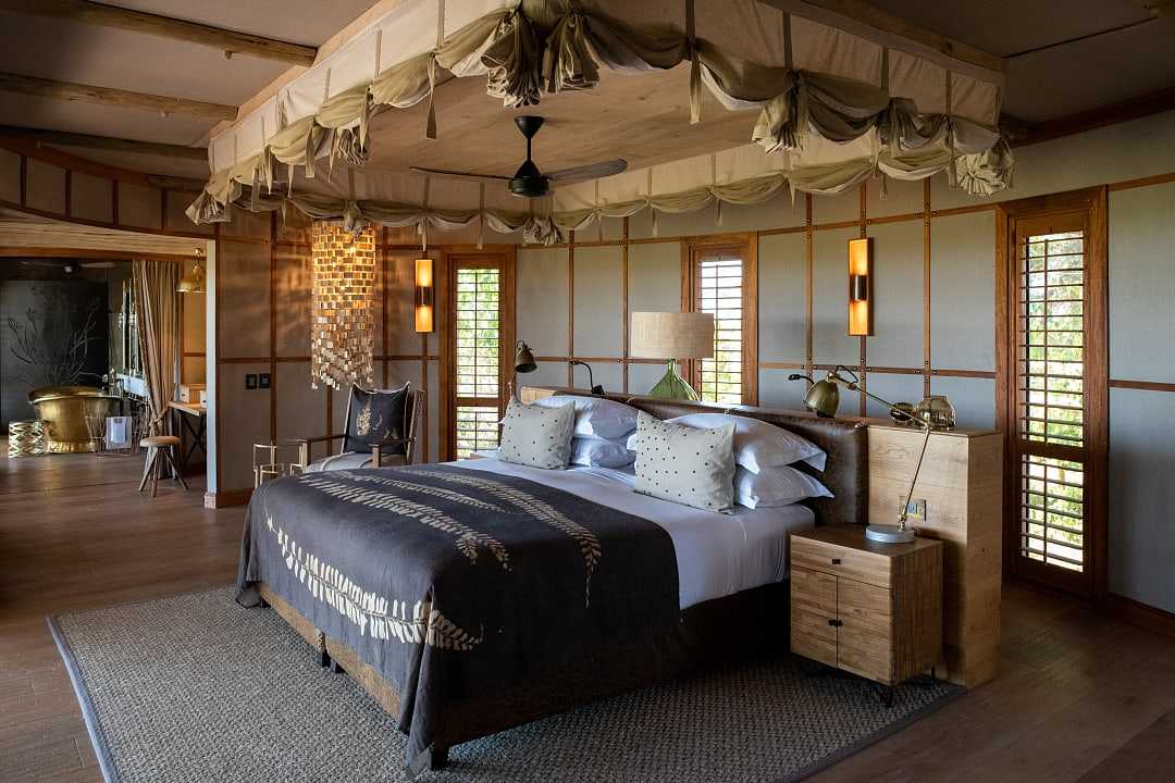 Luxurious bedroom suite at Mombo Camp in the Okavango Delta, Botswana