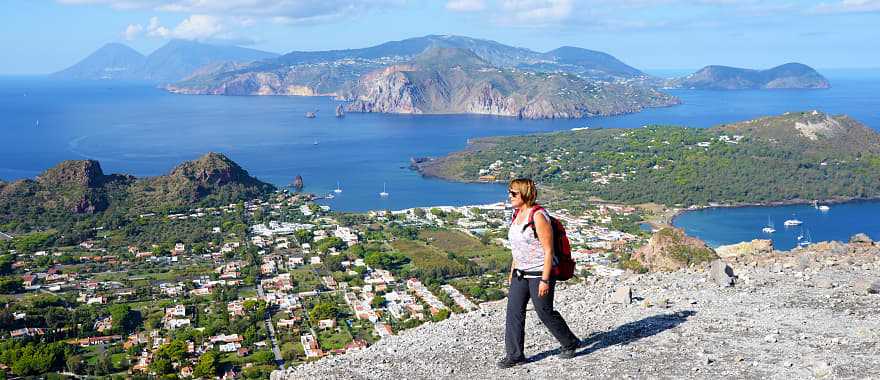 Woman hiking on the Gran Crater on Vulcano, on of seven Aeolian Island in Sicily, Italy