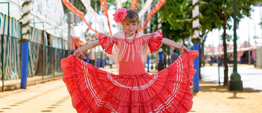 Young girl wearing traditional flamenco dress in Seville, Spain