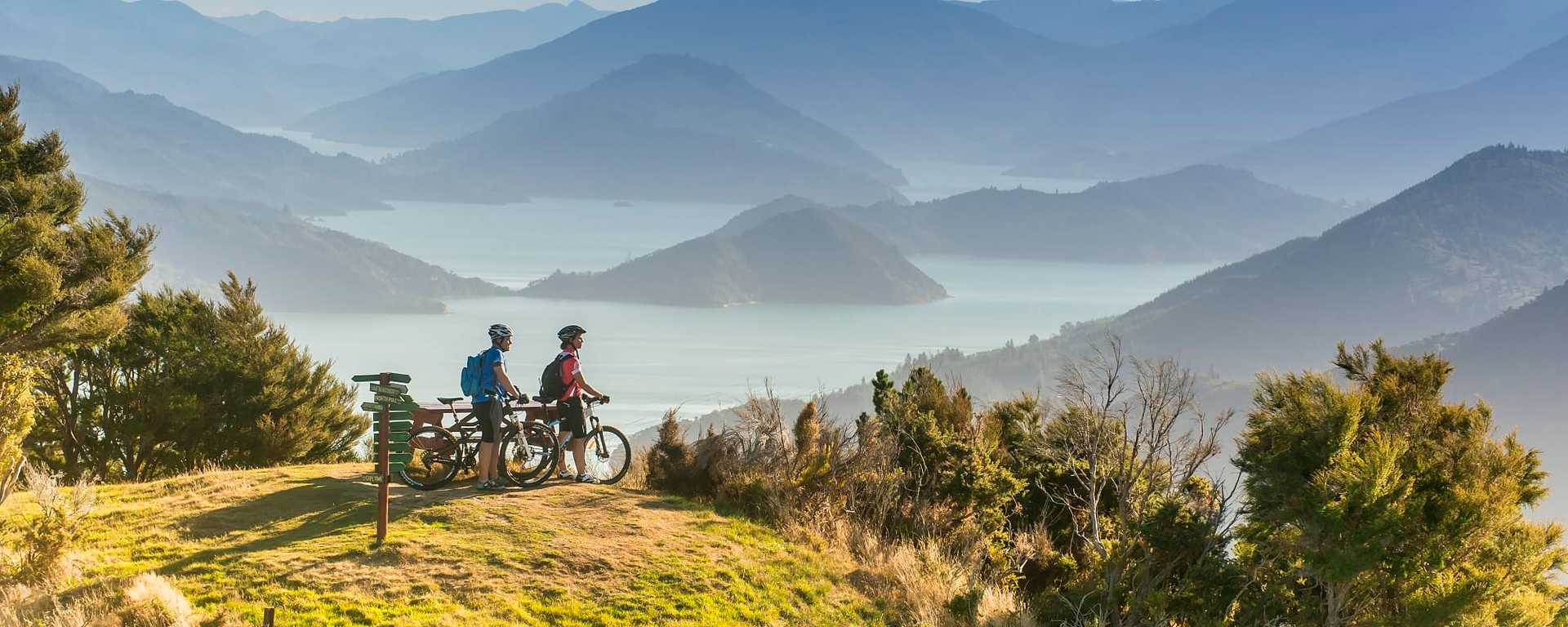 Couple biking in the Marlborough Sounds, New Zealand