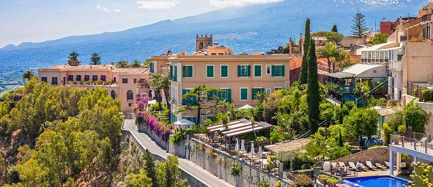 View of Taormina with Etna volcano in Sicily, ital
