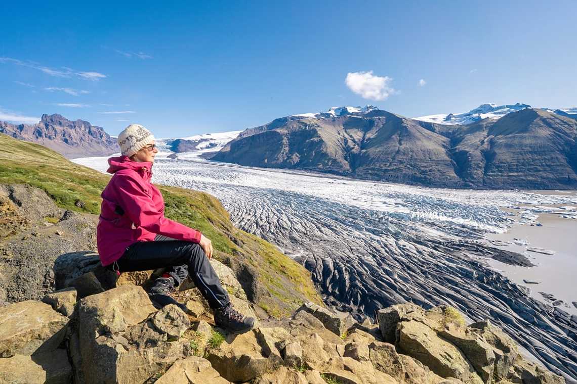 Senior woman overlooking Vatnajokull Glacier in Iceland