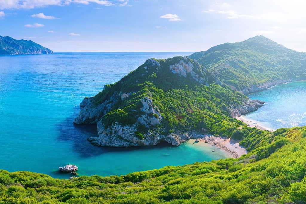 Porto Timoni, the secluded double beach near Afionas village, on the west coast of Corfu island in Greece.