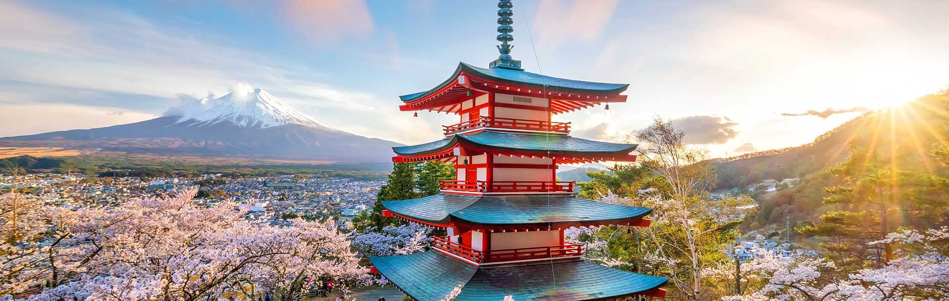 Mountain Fuji and Chureito red pagoda with cherry blossom during Spring in Japan.