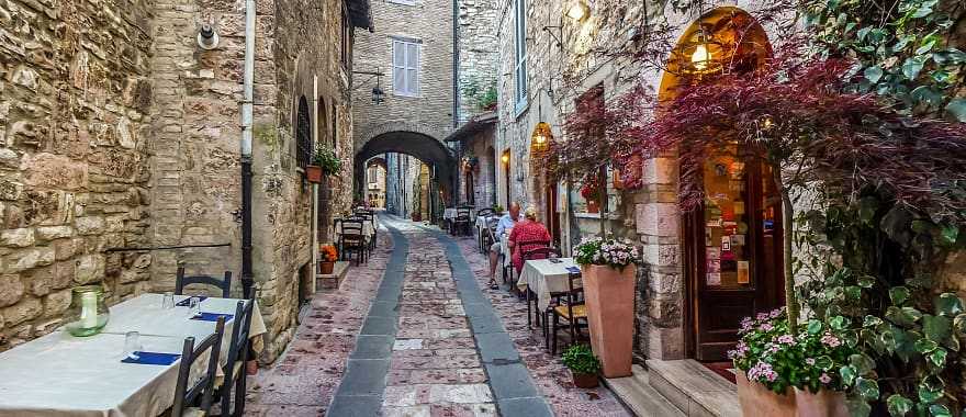 Senior couple at outdoor cafe in Assisi, Umbria, Italy