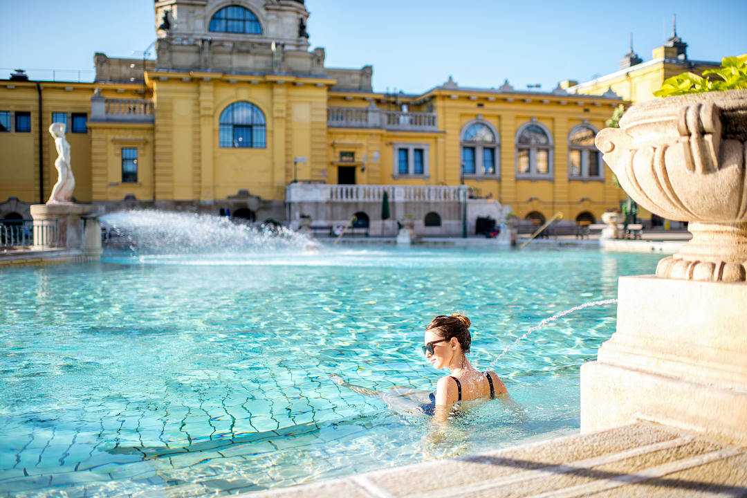 Female traveler relaxing at Szechenyi Thermal Baths in Budapest, Hungary