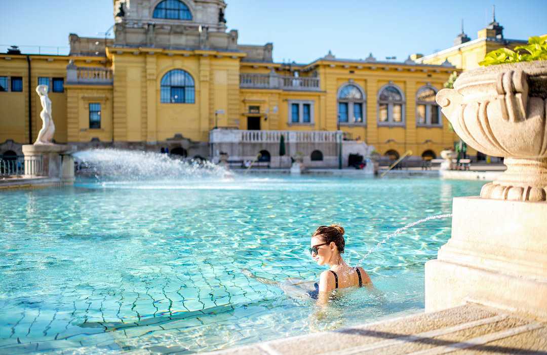 Female traveler relaxing at Szechenyi Thermal Baths in Budapest, Hungary