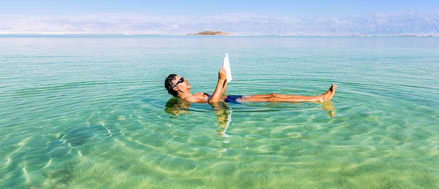 Tourist floating on the Dead Sea in Israel