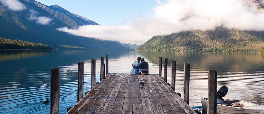 Couple sitting on the pier at Nelson Lake National Park