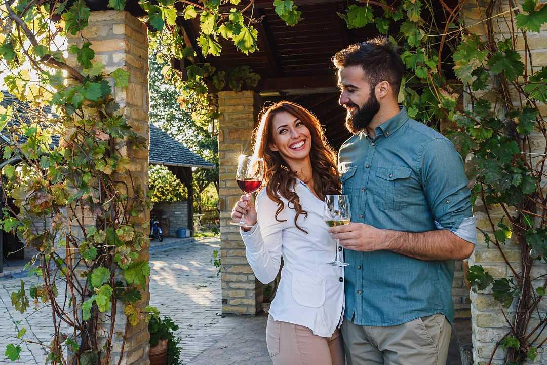 Couple drinking wine at a winery in France