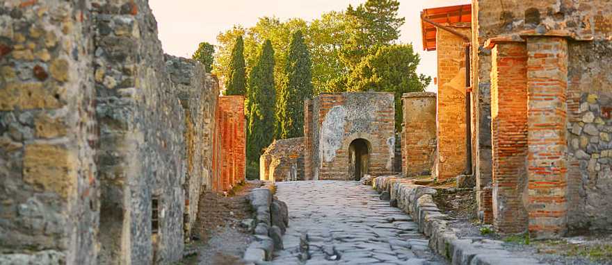 Cobblestone street thru the ruins of Pompeii Cobblestone street thru the ruins of Pompeii