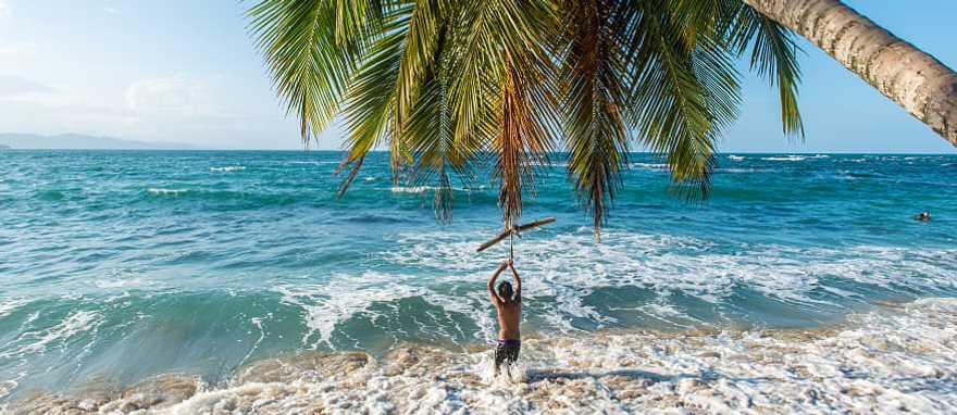 Boy playing on the beach in Costa Rica