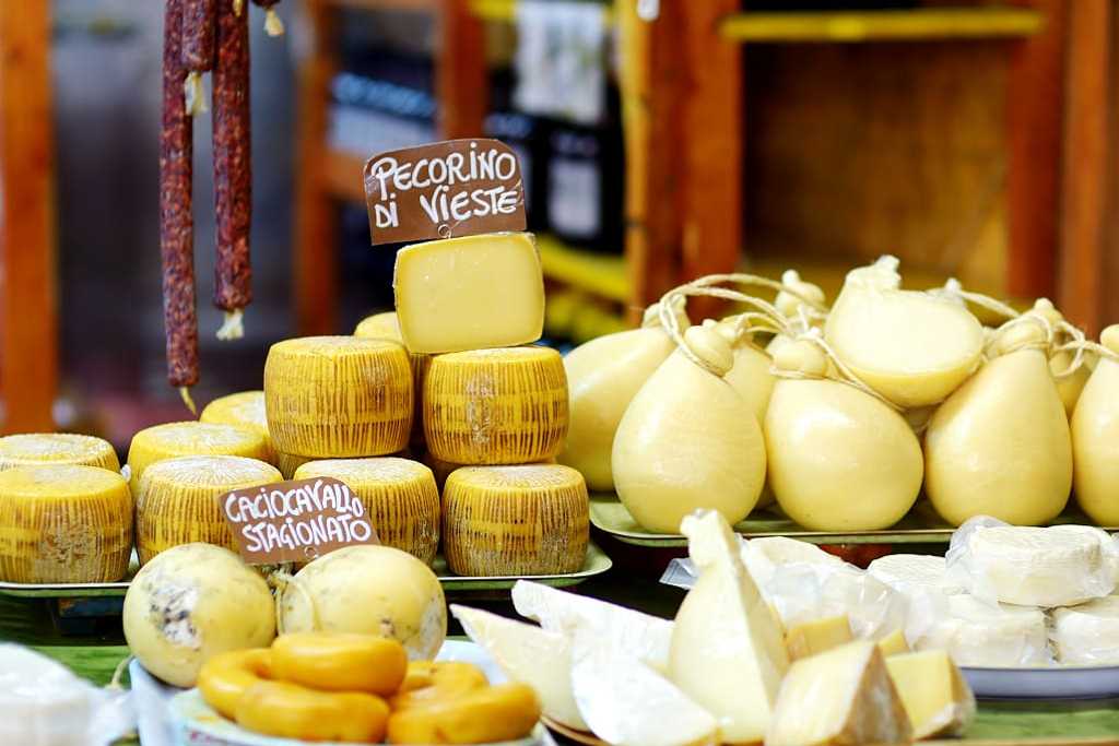 Large selection of cheeses in Italian market