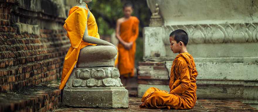 Angkor Wat Temple Complex, Cambodia Buddhist monk in Angkor Wat Temple Complex in Cambodia