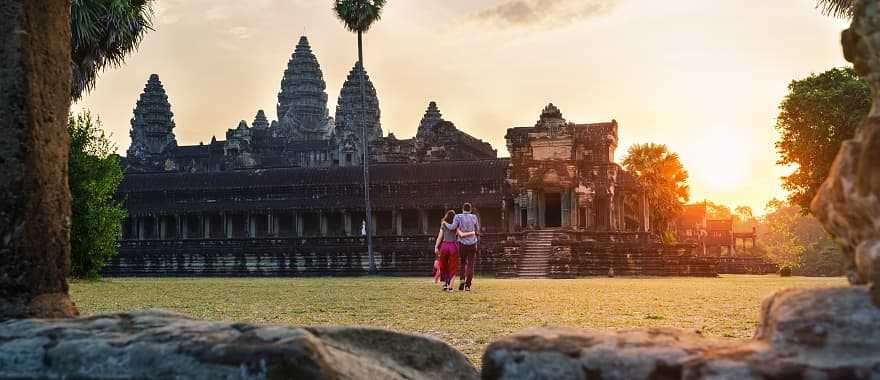 Couple walking thru Angkor Wat in Siem Reap, Cambodia