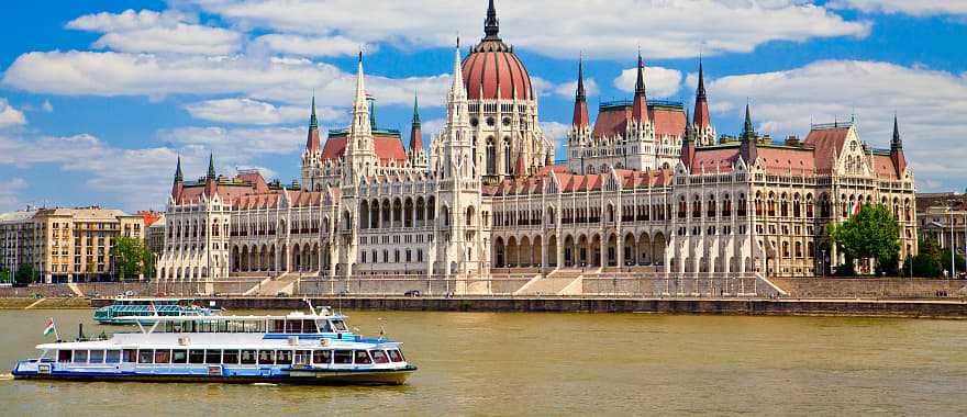 View of the Parliament with boat in Budapest, Hungary