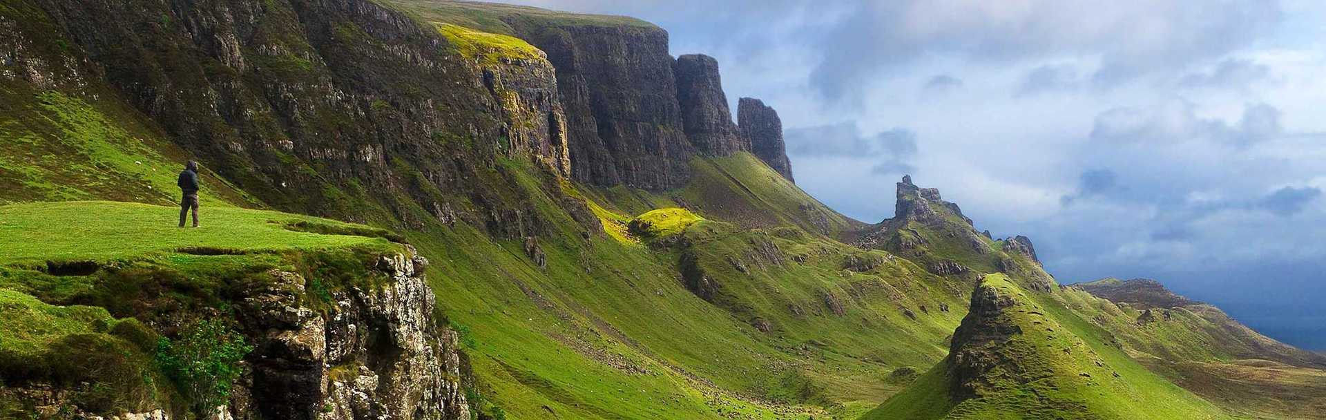 Hiker with a spectacular view the Scottish Highlands.