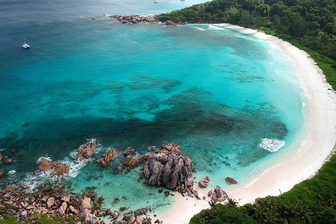 Turquoise waters and iconic granite boulders — paradise found at Anse Lazio, Praslin Island, Seychelles.