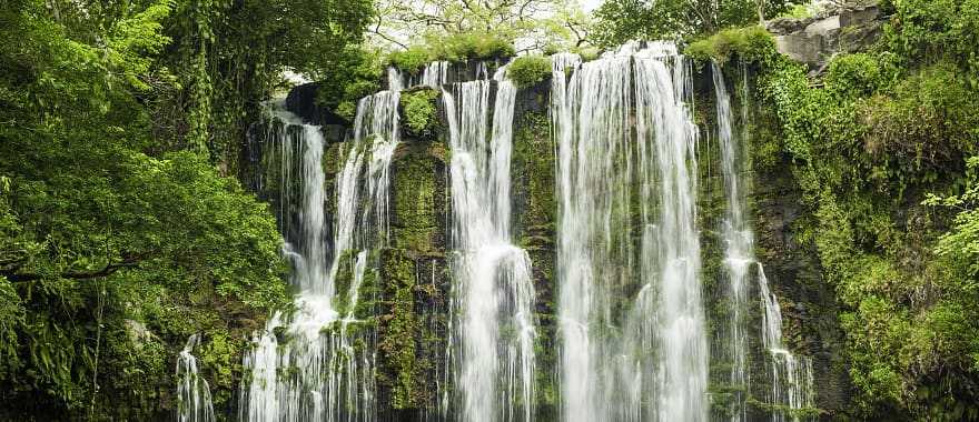 Enjoy the beauty of the waterfalls in the middle of the emerald rainforest, Costa Rica