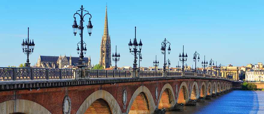 Bordeaux river bridge with St. Michel Cathedral in France